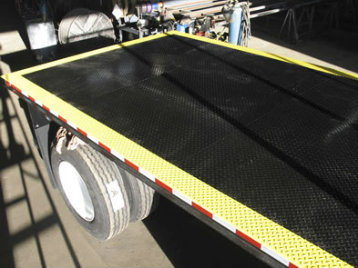 Custom anti-slip barrier added to bed to meet customer requirements.