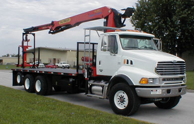 Palfinger PW360 Wallboard/Material Handling Crane package mounted on a Class VIII or Class 8 chassis with a 25' flatbed.