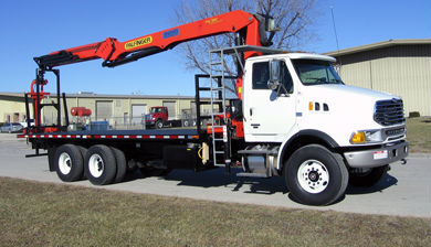Palfinger PW380 Wallboard/Material Handling Crane package mounted on a Class VIII or Class 8 chassis with a 25' flatbed.