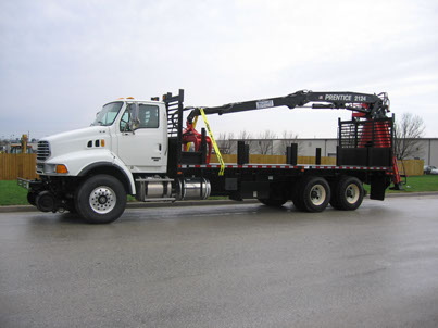 Prentice 2124 installed on Sterling chassis with 25' flatbed, hi-rail gear, generator and magnet systems.